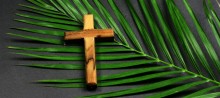 9166-palm-sunday-easter-wooden-cross-on-palm-getty